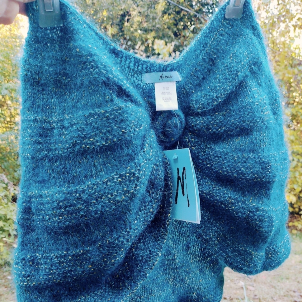 Shoulder shrug. Turquoise-blueish green tint